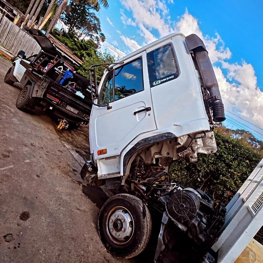 UD truck under on-site repair with the RPM ute alongside